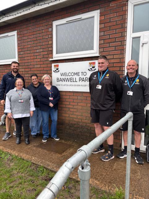 AshwellCare smiling staff with worcester warriors for upton dementia cafe
